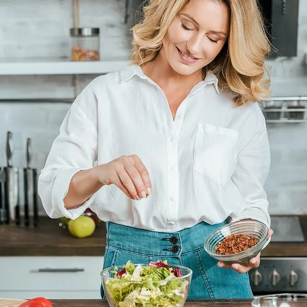 adult woman making salad